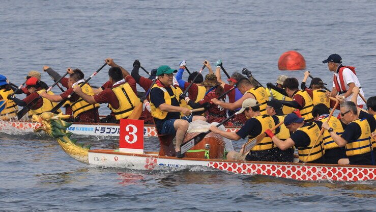 Mr. Yamaya leads Kansai Airports' dragon boat as drummer