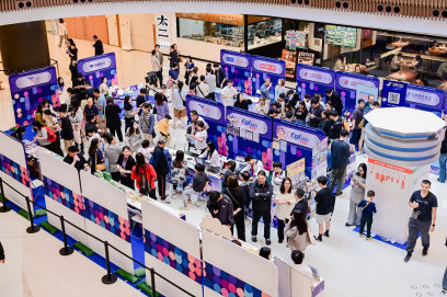 Macau International Airport route promotion event at Nova Mall showcasing new routes, smart services, and airline partnerships with live performances and audience engagement.