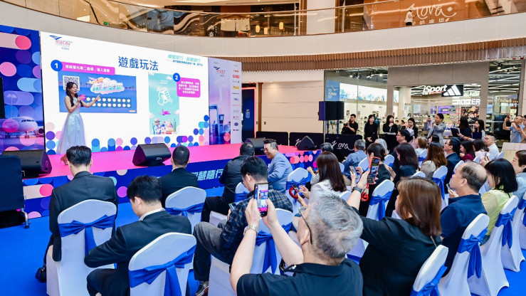 Macau International Airport route promotion event at Nova Mall showcasing new routes, smart services, and airline partnerships with live performances and audience engagement.